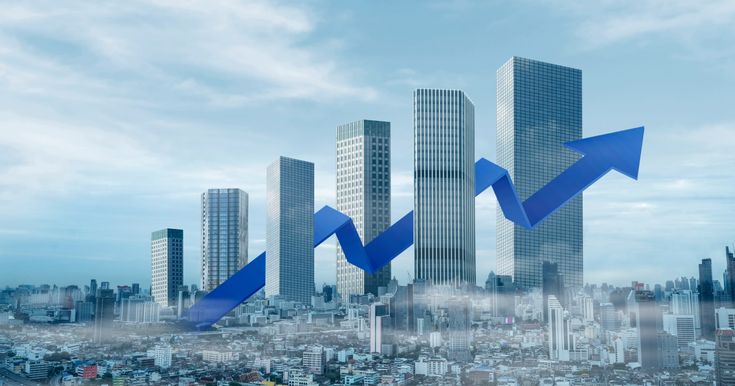 City skyline and upward-moving business graph